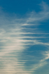 lines of clouds in the blue sky