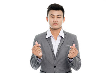 Portrait of a businessman making a heart with his hands. Isolated on white background