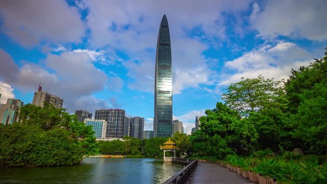 blue sky sunny day shenzhen city park lake sidewalk panorama 4k timelapse china
