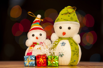 Festive snowman with Christmas light background