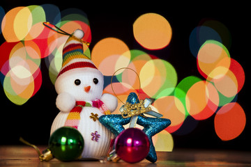 Festive snowman with Christmas light background