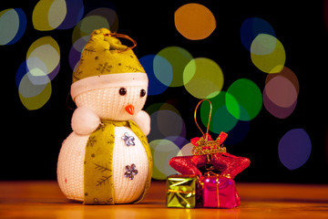 Festive snowman with Christmas light background
