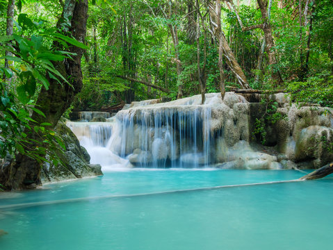 Deep forest waterfall in Thailand (Erawan Waterfall). © bomboman