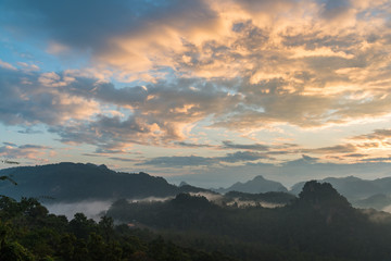 Mountain view with foggy environment during sunrise