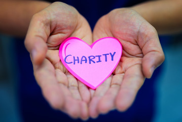 Fototapeta premium Hands asian woman giving red heart,charity,support and helping concept.