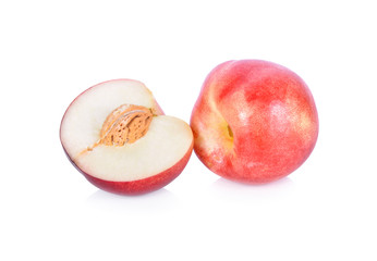 whole and half cut fresh ripe nectarines on white background