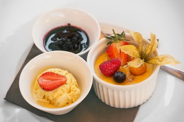 Creme brulee dessert with fruits vith ice cream