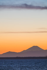 Mountain Fuji and Tokyo bay at sunset time in winter season.Tokyo Bay is a bay located in the southern Kanto region of Japan, and spans the coasts of Tokyo, Kanagawa Prefecture, and Chiba Prefecture.