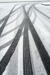 Tire track on the street after snow