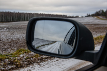 natural landscape reflection in cars mirror