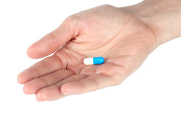 pills in woman hand