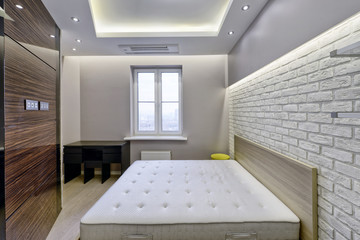 Modern interior of a bedroom in the new house.