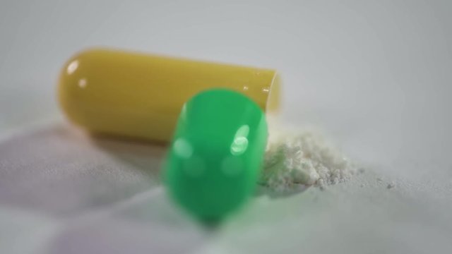 Pharmaceuticals and drugs, view of the opened capsule with medicine. 
