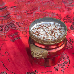 Incense burner with rice on red fabric to celebrate in Chinese New year festival.