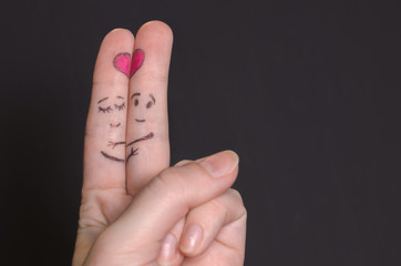 embracing the fingers with sketched faces, Express their love to each other.