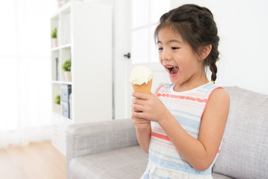 Happy Cheerful Little Girl Kid Holding Ice Cream