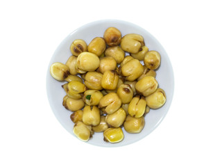 Lotus seeds roasted on white background.