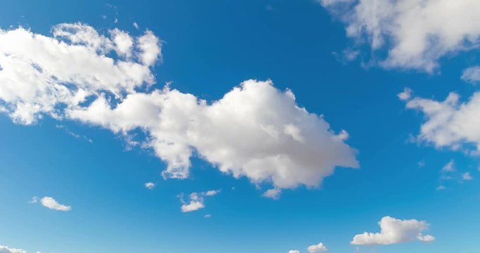 loop of white clouds over blue sky time lapse movement, climate change concept