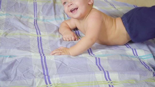 Father with his son doing special gymnastic exercises. Healthy lifestyle. Slow motion