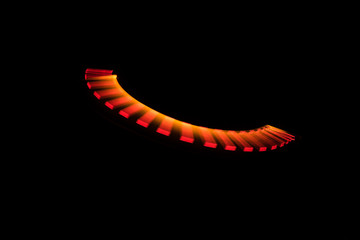 Lightpainting, red and orange curve on black background