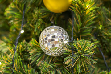 Twinkle ball decorated on Christmas tree background beautifully. 