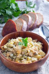 Winter Russian salad with vegetables and meat, selective focus
