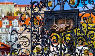 Czech, Prague, gothic bas-relief  of John of Nepomuk on the Charles bridge. Prague, medieval art, bass-relief of Saint on the bridge of King Charles.