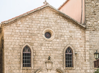 Fototapeta na wymiar Fragment of the church in the old town of Budva, Montenegro.