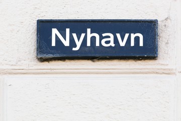 Plate with the name of the street  Nyhavn in Copenhagen, Denmark