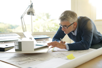 Architect in office working on 3D model