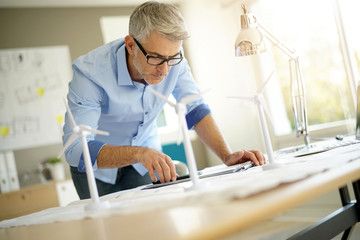 Industrial engineer working on wind turbines implantation