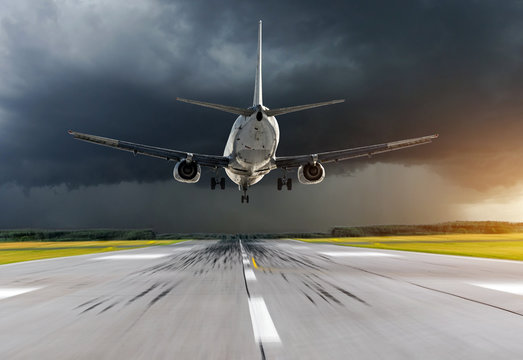 Airplane Approach At The Airport Landing In Bad Weather Storm Hurricane Rain.