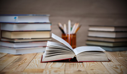 Textbooks and books on a wooden table