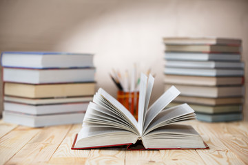 Textbooks and books on a wooden table