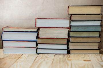Textbooks and books on a wooden table