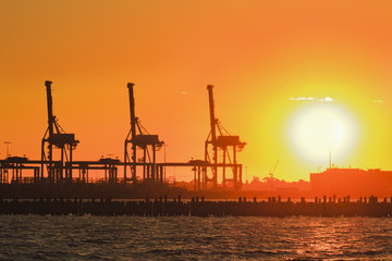 Me Port 3 cranes orange sun