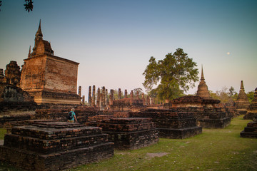 Fototapeta na wymiar Ancient ruin temple and pagoda at Sukhothai Historical Park