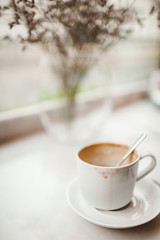 White Cup of Drunk Coffee with a Trace of Lipstick