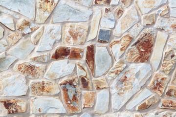 Unregular patterned white and brown wall texture background - typical masonry on Canary Islands, Spain