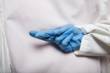 Close-up of doctor making fingers crossed gesture on the back