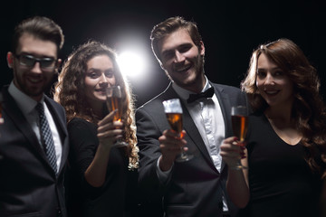 portrait of a group of friends celebrating their success