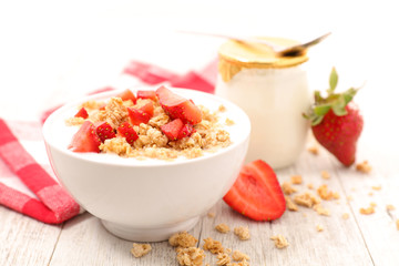 bowl of cereal,yogurt and strawberry