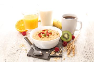 oat meal,coffee cup and orange juice
