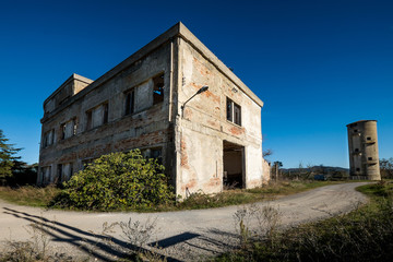 Fototapeta na wymiar Volterra, Pisa, Italy - November 1, 2017: former Colonia Tanzi today abandoned, hikers depart from Saline for the Volterra hills