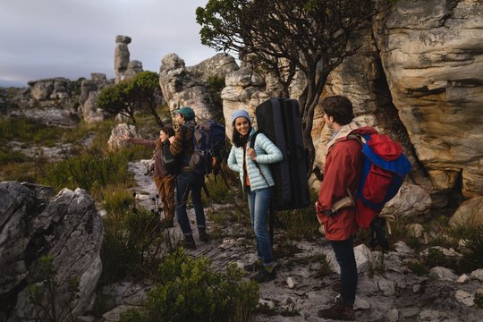 Group of hikers standing with rucksack