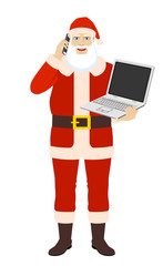 Santa Claus talking on the mobile phone and  holding laptop computer