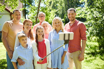 happy family taking selfie in summer garden