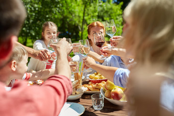 happy family having dinner or summer garden party