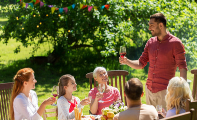 happy family having dinner or summer garden party