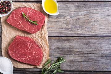 Raw beef steak with rosemary